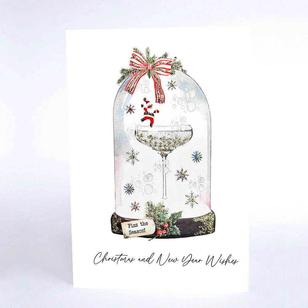 Christmas card with a glass dome design featuring Santa Claus and festive elements on a white background.