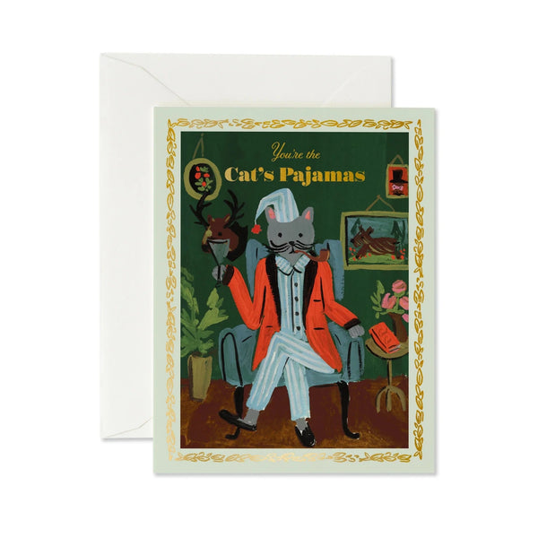 Greeting card with a cat in a suit and hat sitting in a chair, surrounded by decorative elements.