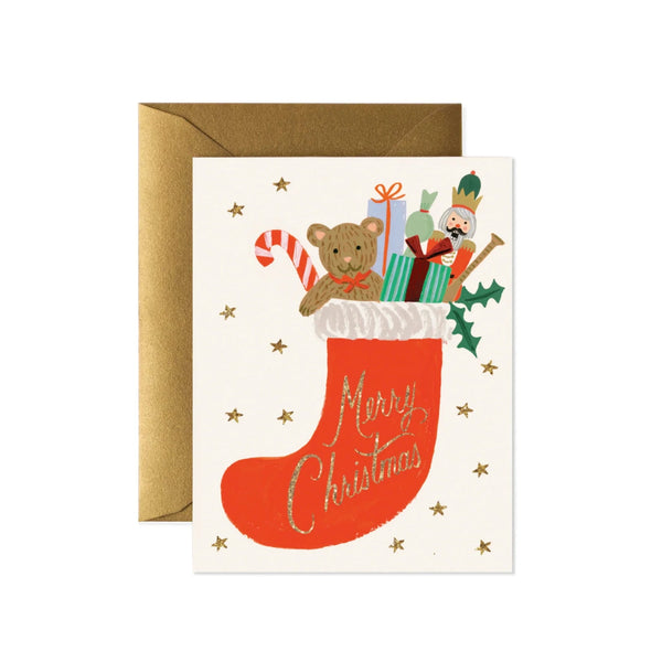 Christmas card with a stocking, teddy bear, and presents on a white background