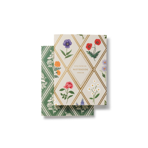 Two notebooks with floral designs on a white background