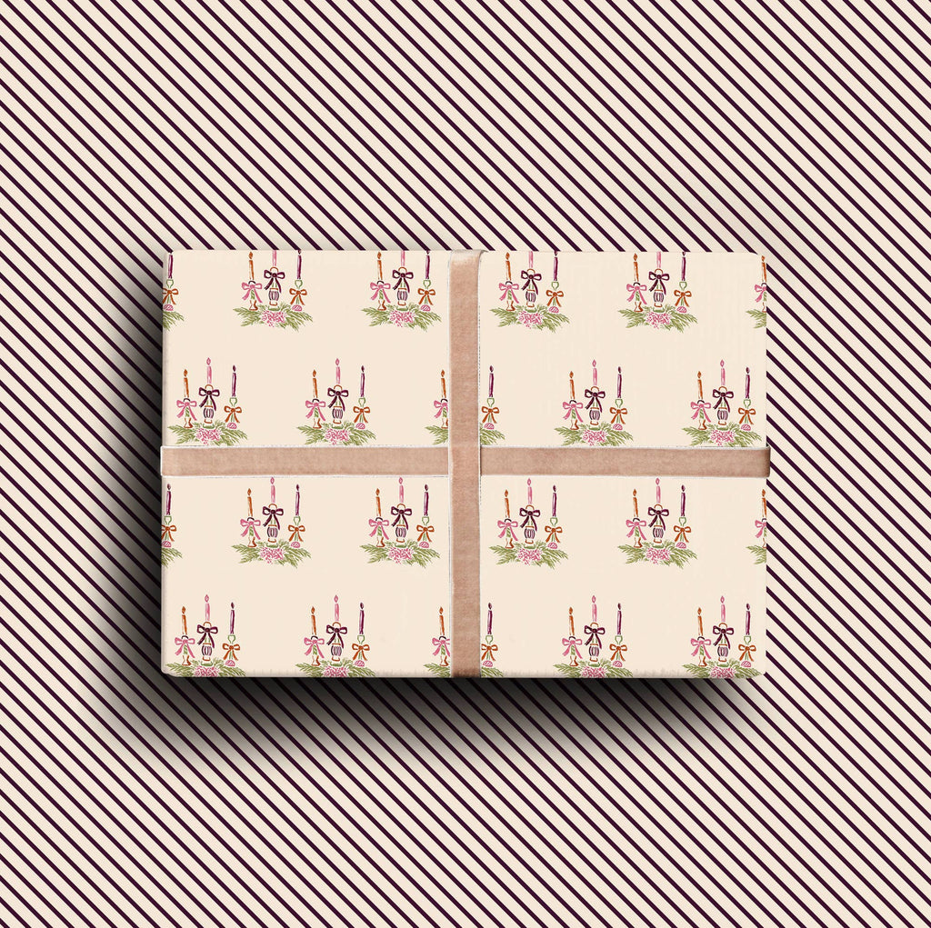 Pack of four luxury Christmas cards with gold foil candle illustrations on textured cream cardstock with envelopes.