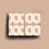 Pack of four luxury Christmas cards with gold foil, featuring festive stocking illustrations on textured cream cardstock.