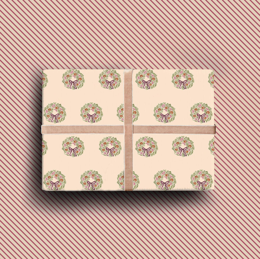 Pack of four luxury Christmas cards with gold foil wreath illustrations on textured cream cardstock with envelopes.