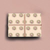 Pack of four luxury Christmas cards with gold foil wreath illustrations on textured cream cardstock with envelopes.