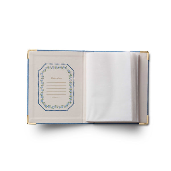 Open notebook with decorative cover on a white background