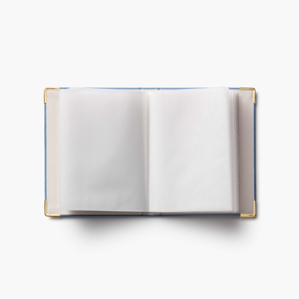 Open notebook with blank pages on a white background