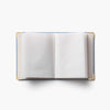 Open notebook with blank pages on a white background