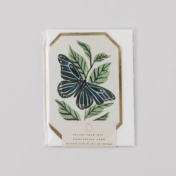 Greeting card with butterfly and leaf design on a white background
