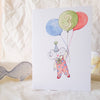 Children's birthday card with a cartoon elephant holding balloons and the number 3 on a white background.