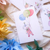 Children's birthday cards with balloons and numbers on a soft fabric background