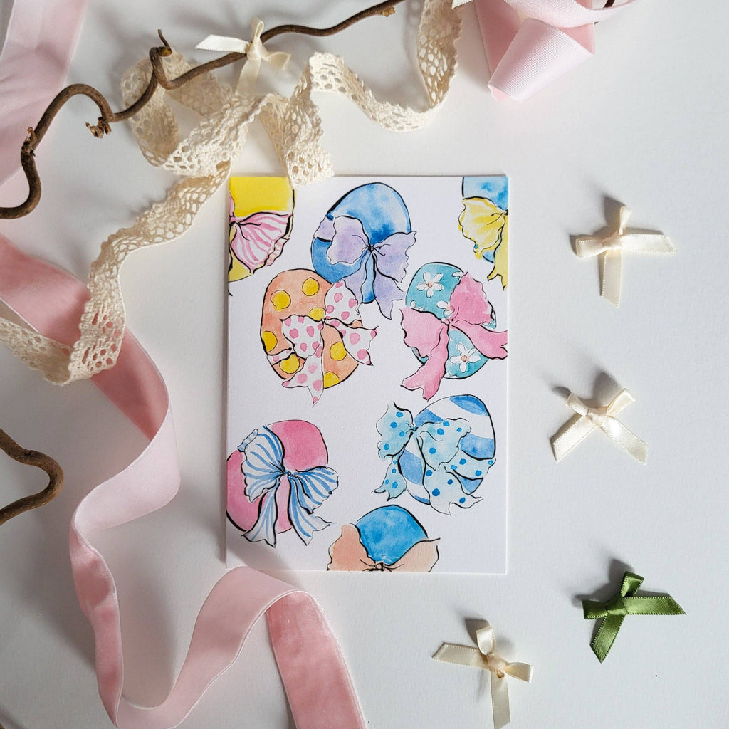 Sheet of decorative stickers with colorful designs on a white background with ribbons.