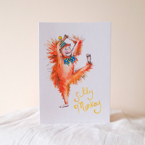 Card with a colorful illustration of a monkey and text 'Silly Monkey' on a white background.