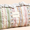 Patterned fabric roll with 'Lisa Angel' label on a beige background