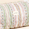 Decorative pillow with floral and stripe pattern and 'Lisa Angel' label.