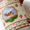 Decorative paper with a cow illustration and colorful border
