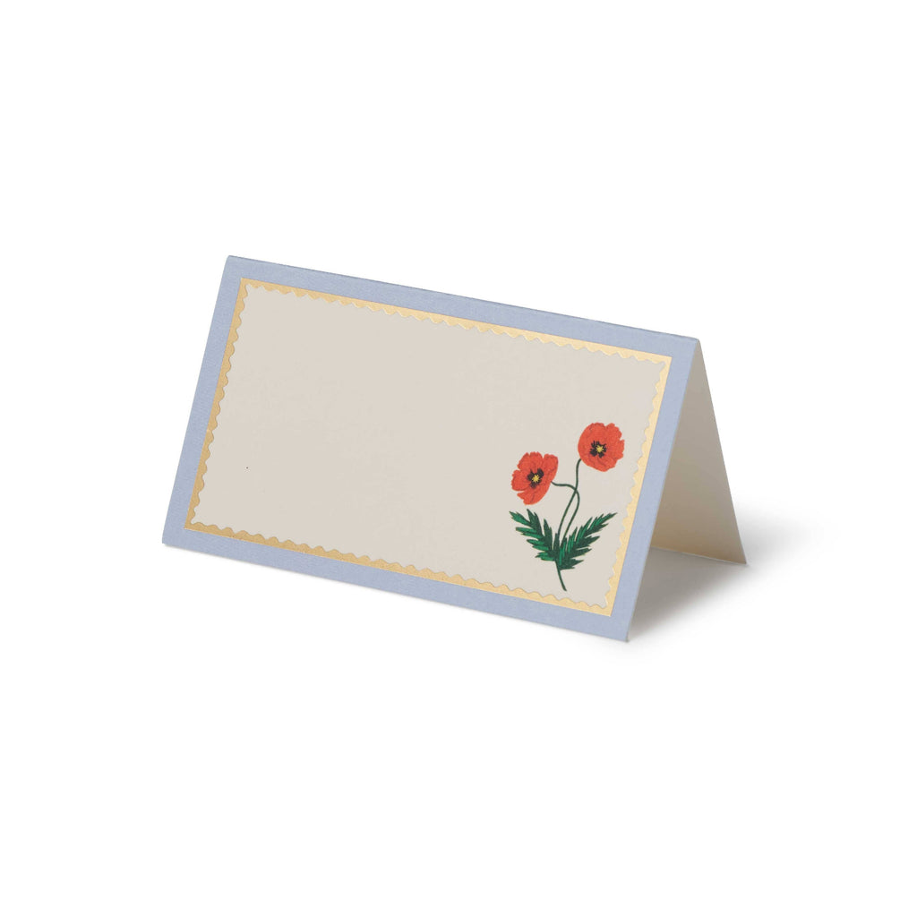 Folded card with red poppy design on a white background