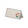 Folded card with red poppy design on a white background