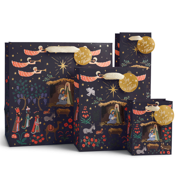 Set of Christmas-themed gift bags with nativity scene design on a white background