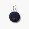 Round navy blue pouch with gold trim and 'Ruthie May' branding on a white background