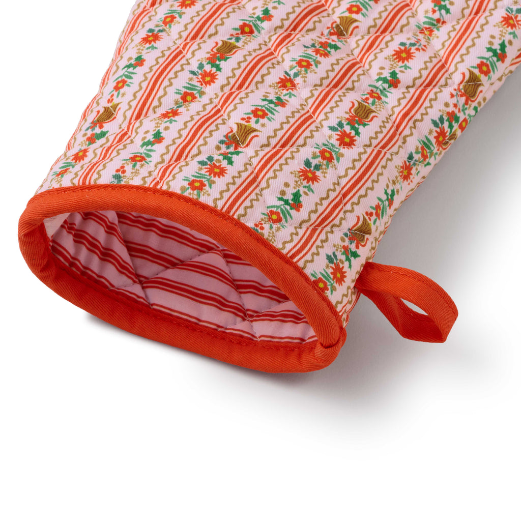 Decorative oven mitt with floral pattern on a white background