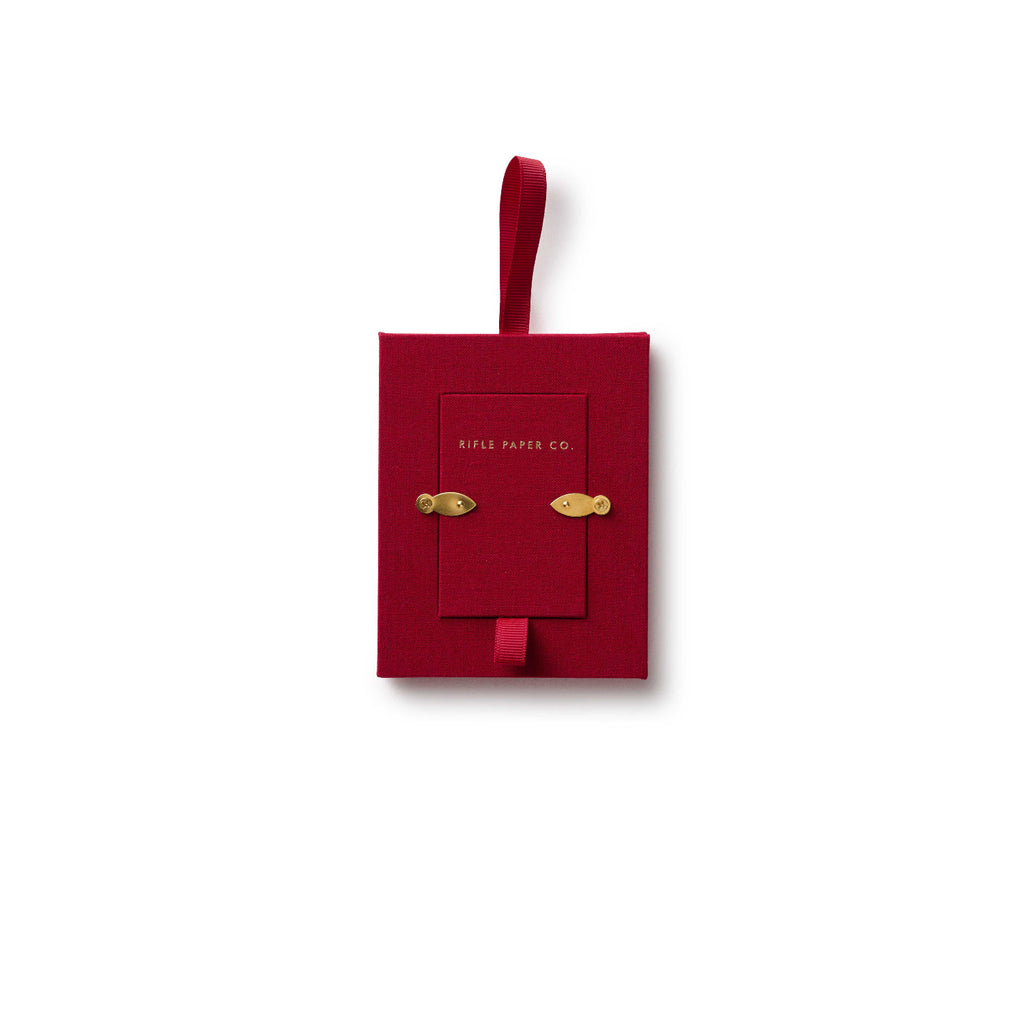 Red decorative box with gold accents on a white background