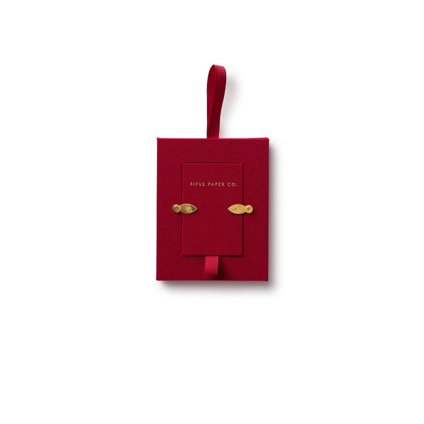 Red decorative box with gold accents on a white background