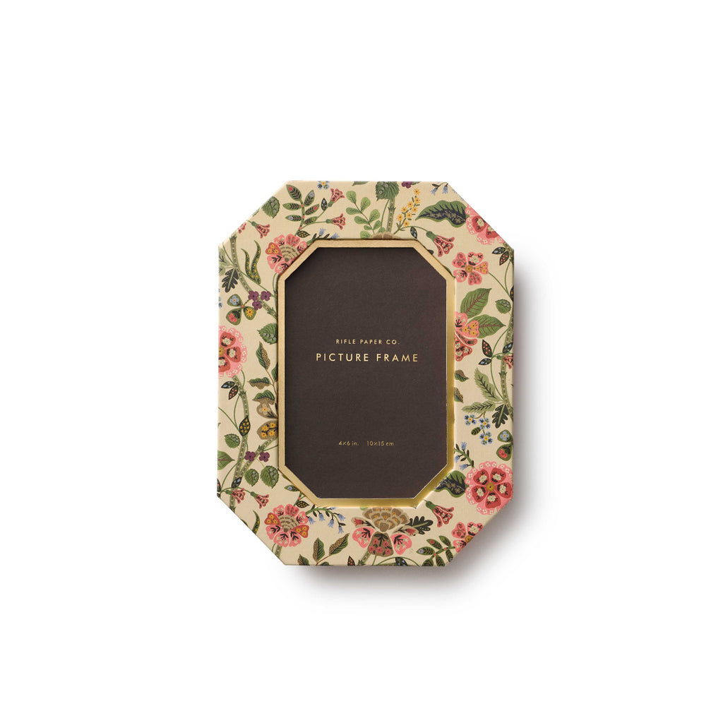 Decorative picture frame with floral design on a white background