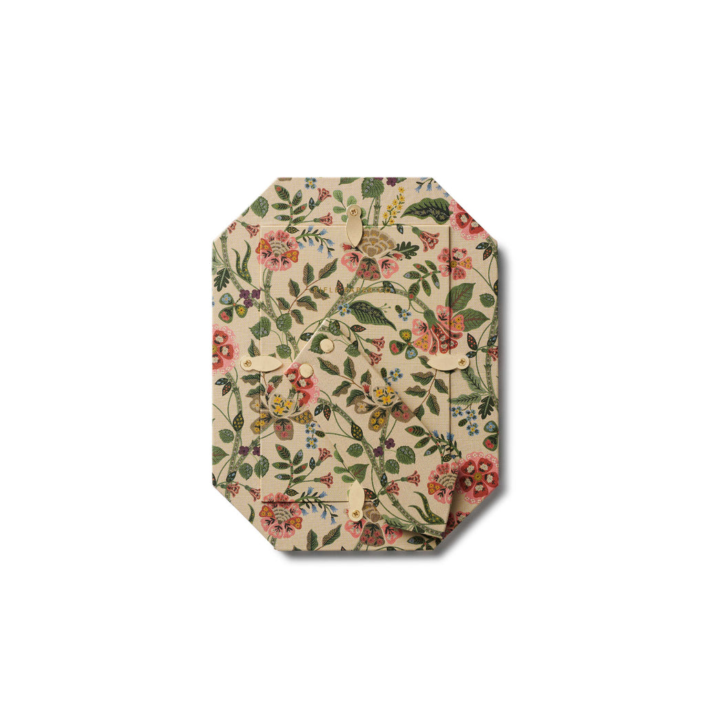 Hexagonal placemat with floral pattern on a white background