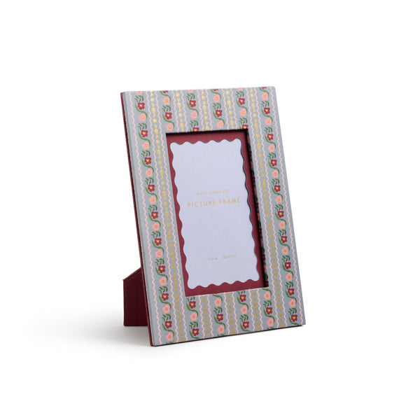 Decorative photo frame with a patterned border on a white background