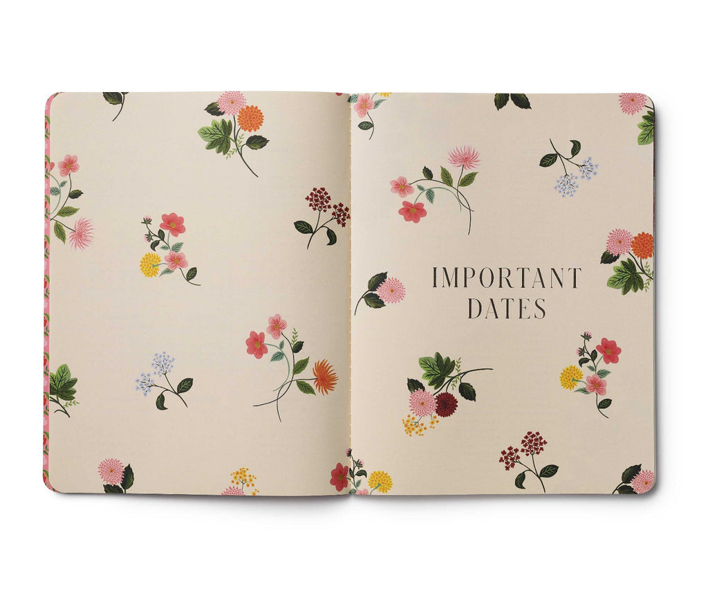 Floral-patterned notebook with 'Important Dates' text on a beige background
