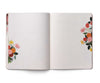 Open notebook with floral designs on a white background