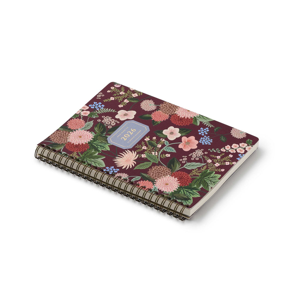 Floral notebook with a purple label on a white background