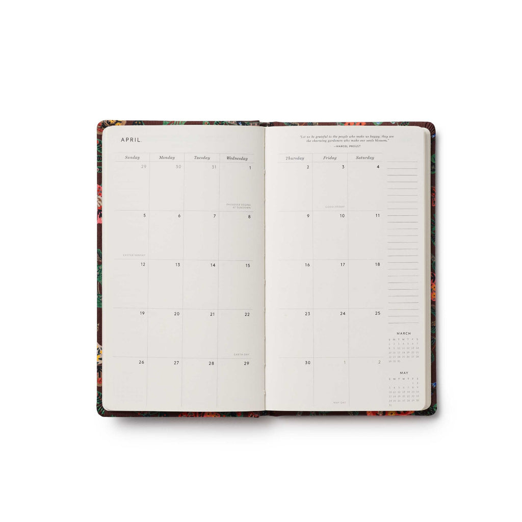 Open planner with floral design on a white background