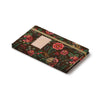 Floral patterned notebook on a white background