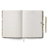 Open planner with floral design on a white background