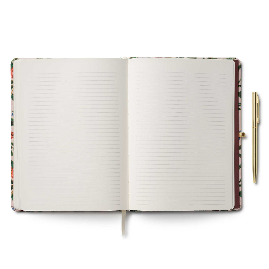Open notebook with lined pages and a pen on a white background