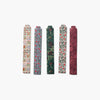 Five floral-patterned hair clips on a white background