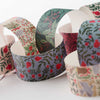 Decorative paper cups with floral patterns on a white surface