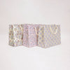 Set of three patterned boxes on a light gray background