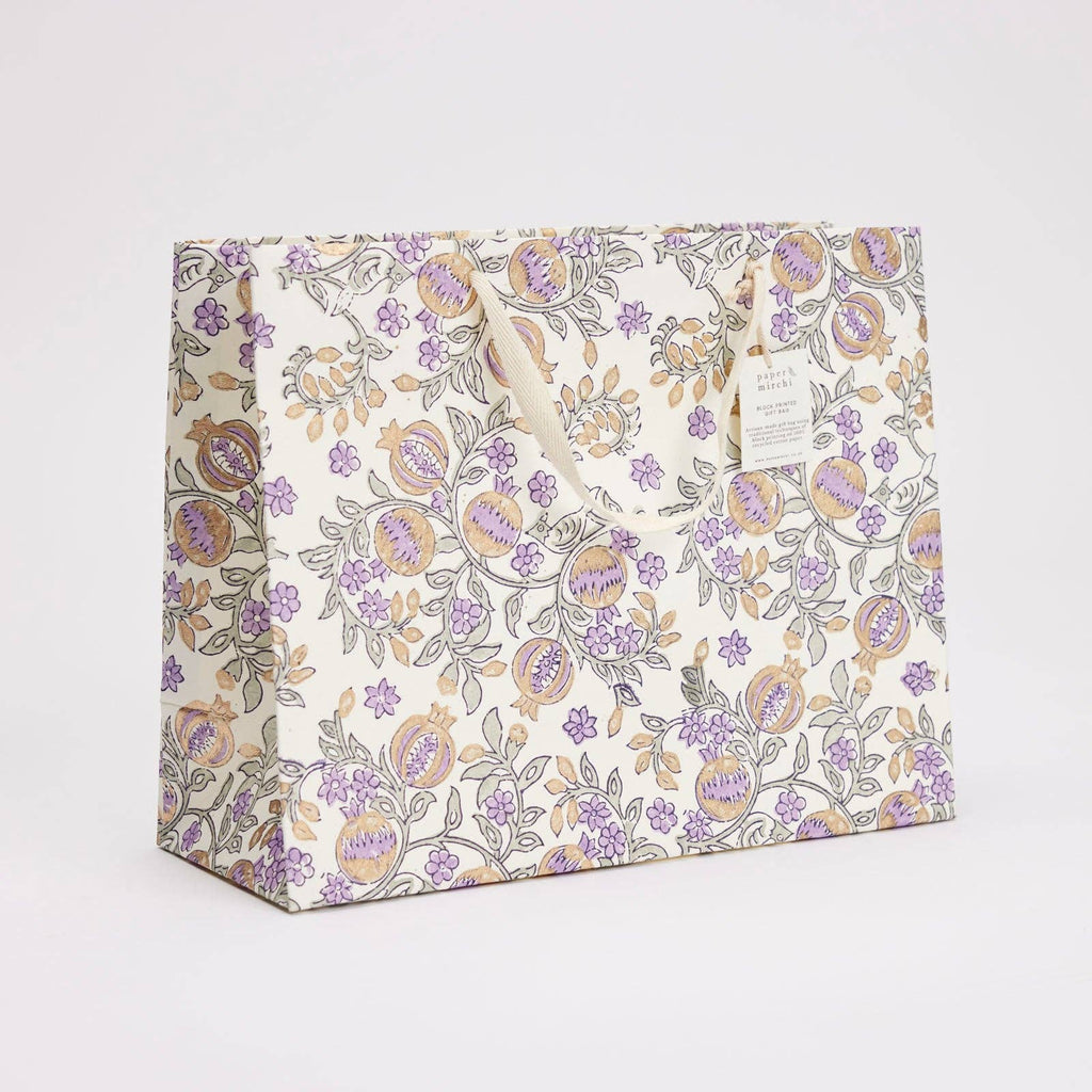Floral patterned gift bag on a white background
