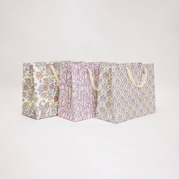 Set of three patterned boxes on a light gray background