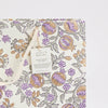 Gift bag with floral and fruit pattern on a white background