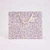 Floral-patterned gift bag on a white background