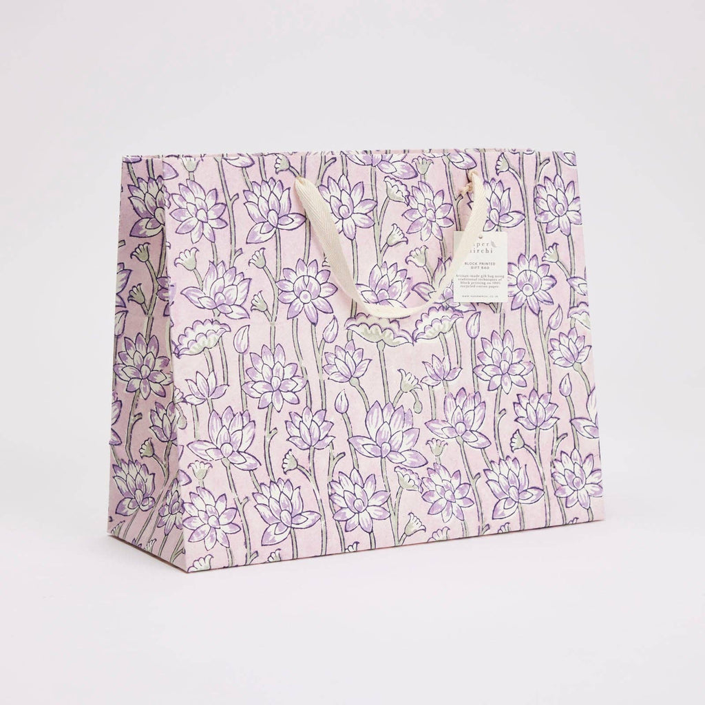 Floral-patterned gift bag on a light gray background