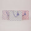 Floral and checkered patterned bag on a light gray background