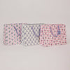 Three patterned bags on a light gray background