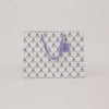 Patterned paper bag with a handle on a light gray background