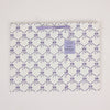 Patterned bag with purple bows on a white background