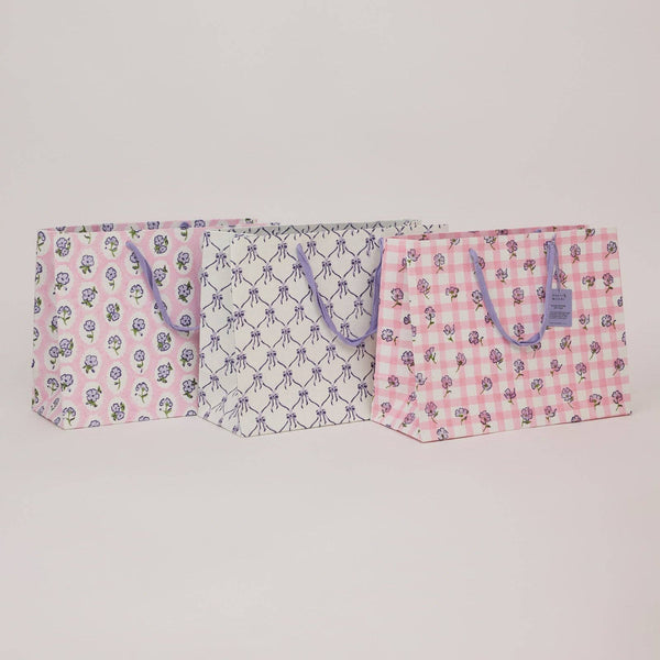 Three patterned bags on a light gray background