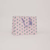 Floral-patterned bag on a light pink background